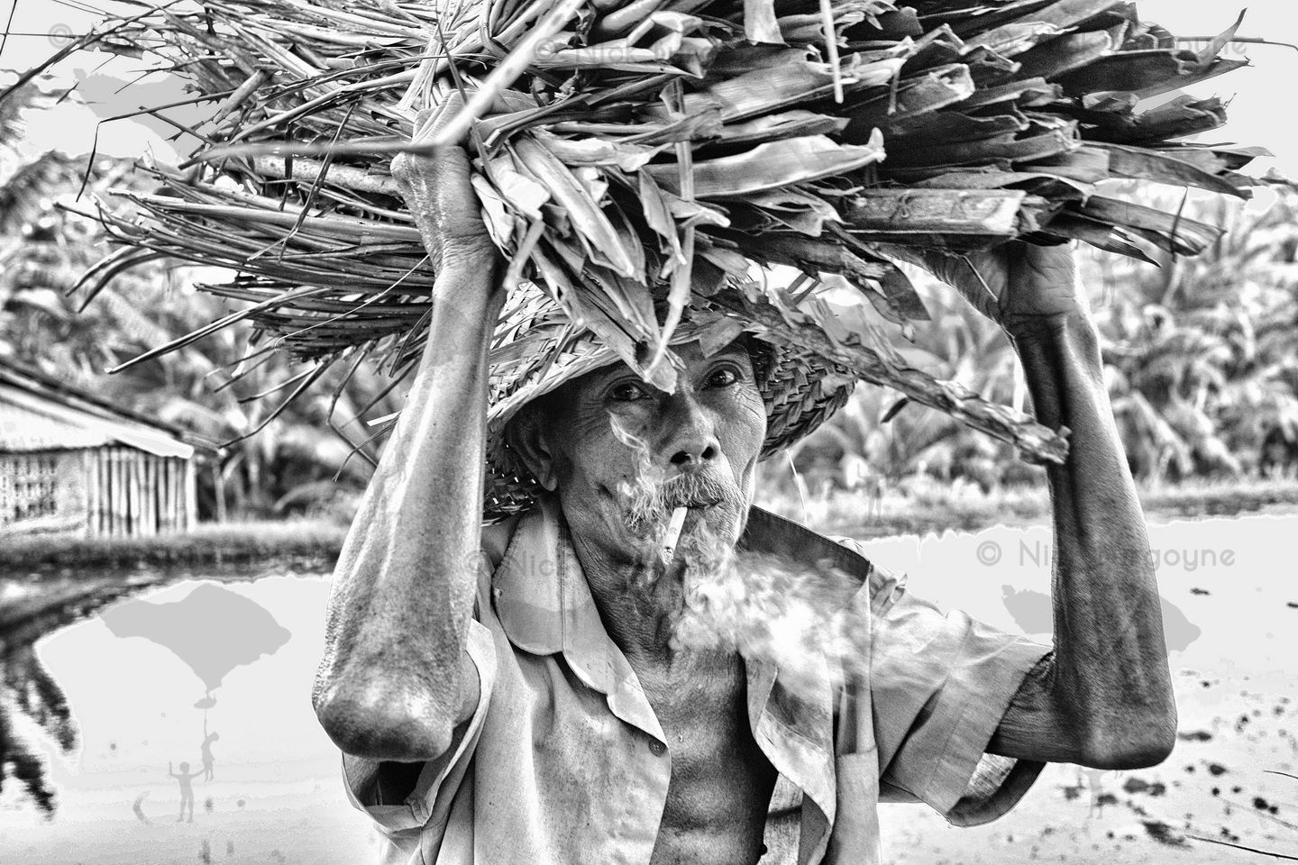 	Pak Ketut Munro With A Bundle of Sticks	 