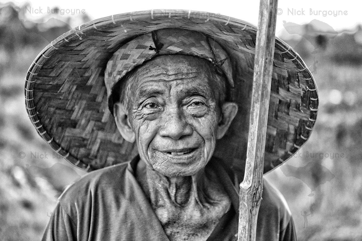	Elder Farmer With A Bamboo Stick	 