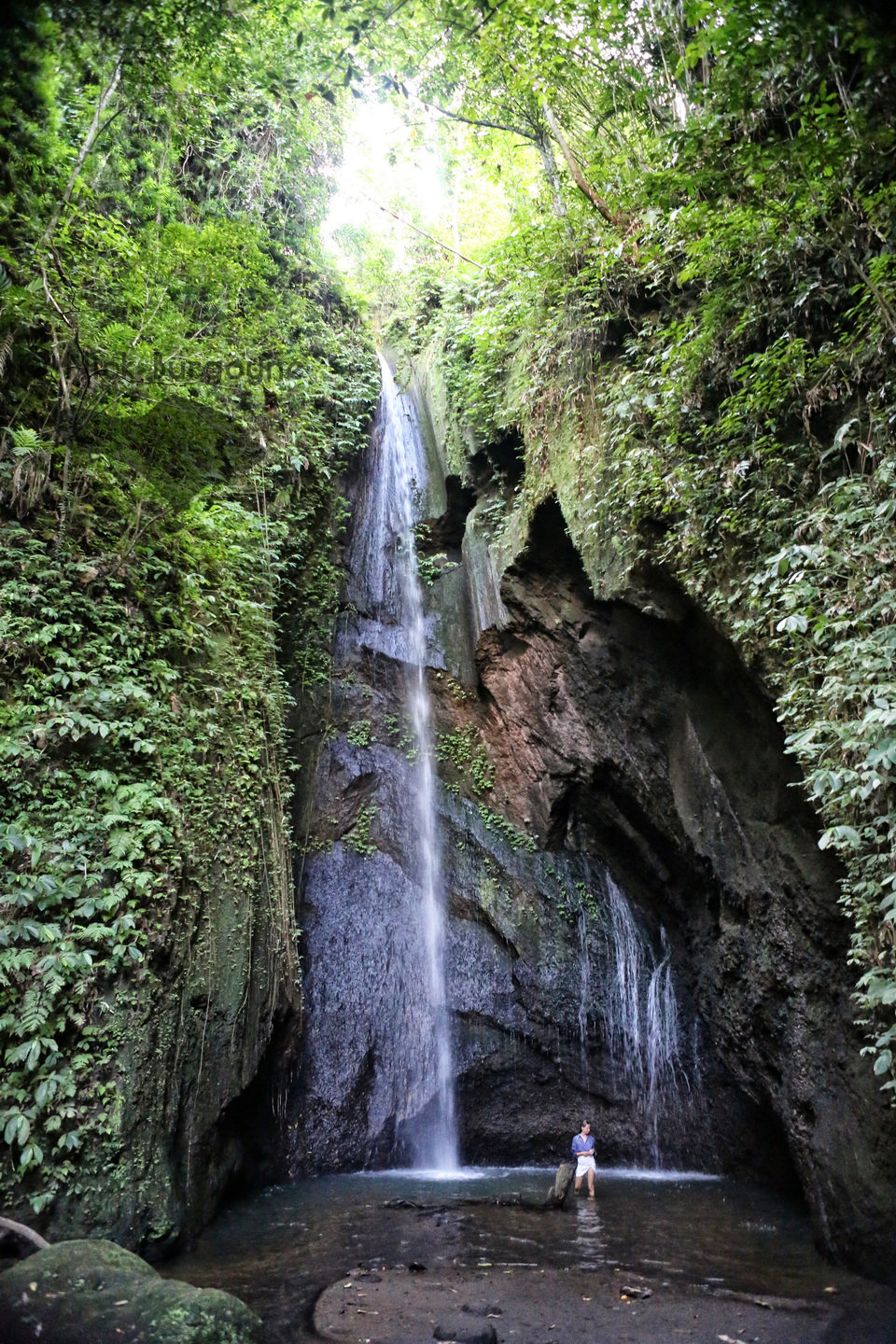 Girl Under a Waterfall - Cau Belayu 